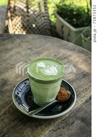 Matcha latte with latte art on top 73873352