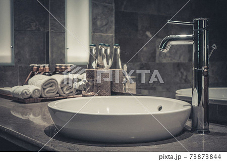 Contemporary mixer tap in the bathroom Contemporary mixer tap in the bathroom 73873844