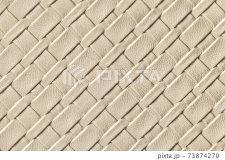 Texture of light beige and sand leather background with wicker pattern, macro. 73874270