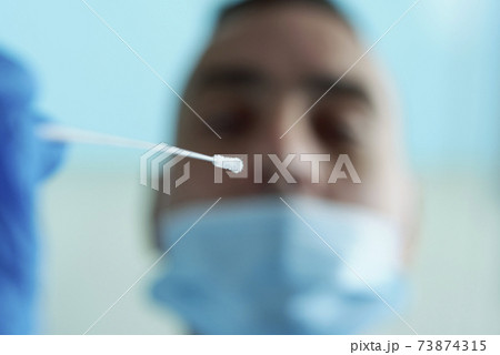 about to take a nasopharyngeal culture to a man about to take a nasopharyngeal culture to a man 73874315