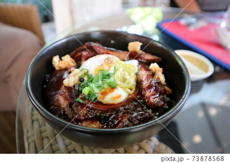 pork ,rice topped with pork and egg 73878568