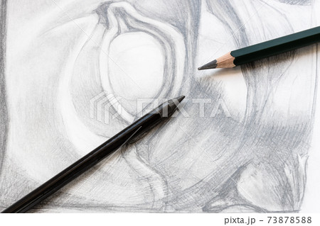 two various graphite pencils on drawing of eye 73878588