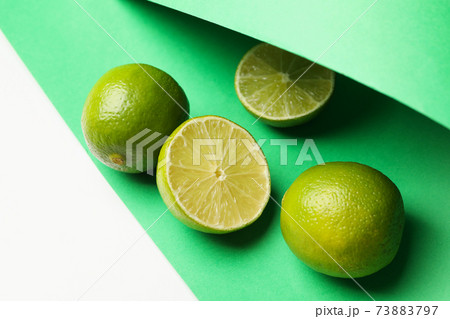 Fresh ripe lime on two tone background, close up 73883797