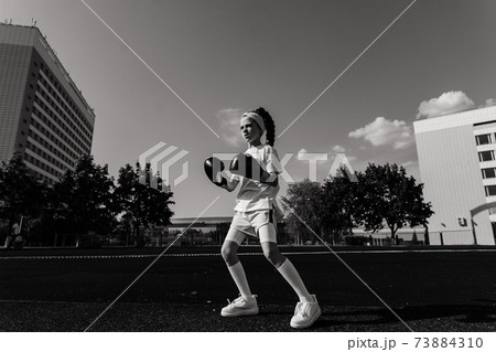 Female child boxer in gloves, feminism concept. Back to school, physical training lesson. 73884310