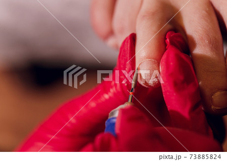 Therapeutic pedicure. Master podologist does hardware pedicure. visit to the podiatry. Foot treatment in the spa. Clinic of Podiatria. Therapeutic pedicure. Master podologist does hardware pedicure. visit to the podiatry. Foot treatment in the spa. Clinic of Podiatria. 73885824