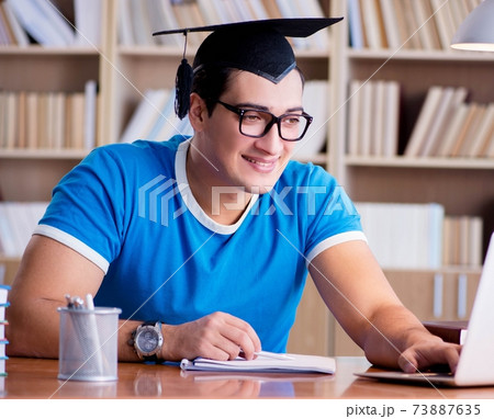 Young man graduating from university 73887635