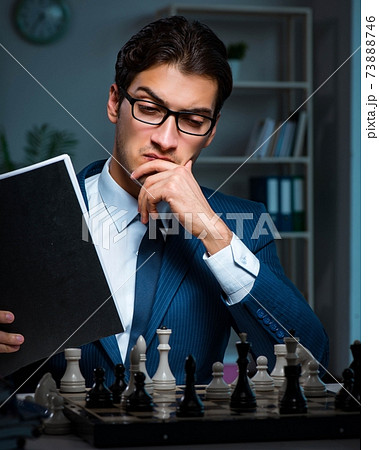 Businessman playing chess in strategy concept Businessman playing chess in strategy concept 73888746