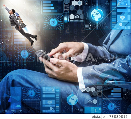 Businessman with smartphone in startup concept Businessman with smartphone in startup concept 73889815