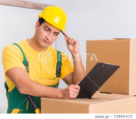 Transportation worker delivering boxes to house Transportation worker delivering boxes to house 73895472