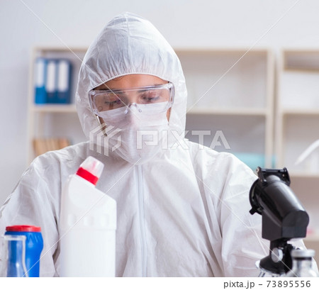 Chemist checking the quality of bathroom supplies Chemist checking the quality of bathroom supplies 73895556