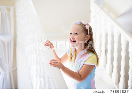 Kids on stairs. Child moving into new home. 73895827