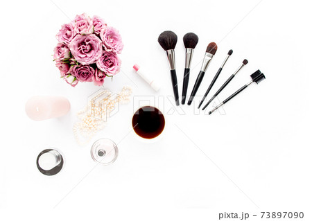Makeup tools. Home office workspace. Female fashion, makeup brushes, cup of coffee on white background. Flat composition. Top view. Flat lay. Makeup tools. Home office workspace. Female fashion, makeup brushes, cup of coffee on white background. Flat composition. Top view. Flat lay. 73897090