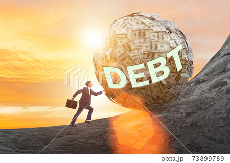 Businessman pushing dollar uphill in debt loan concept 73899789