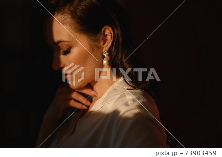 beautiful woman wearing earrings. Woman middle age with stylish accessories, closeup beautiful woman wearing earrings. Woman middle age with stylish accessories, closeup 73903459