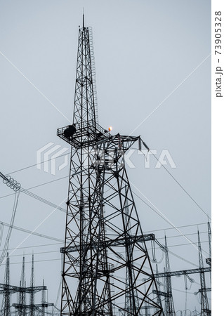 High-voltage power lines. Vertical photo. Transmission of electricity. 73905328