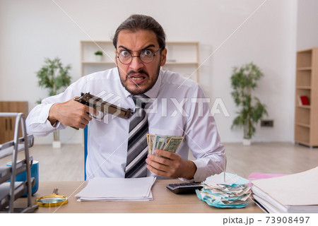 Angry male bookkeeper in bankruptcy concept Angry male bookkeeper in bankruptcy concept 73908497