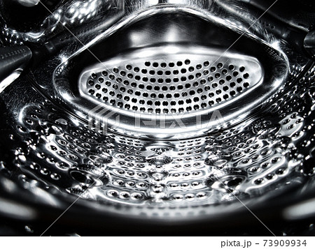 Washing machine drum closeup. Washing machine drum closeup. 73909934