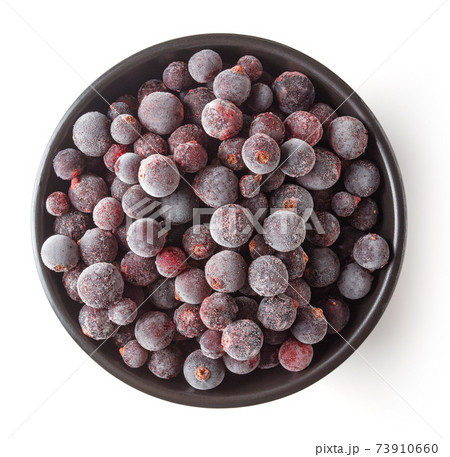 Bowl of frozen blackcurrant isolated on white, from above Bowl of frozen blackcurrant isolated on white, from above 73910660