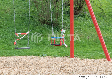 Corona virus quarantine lockdown playground swings 73914356