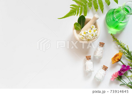 Homeopathic globules bottle with herb, flower,...の写真素材 [73914645] - PIXTA