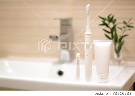 Oral hygiene and dental health concept, electric toothbrush 73916233