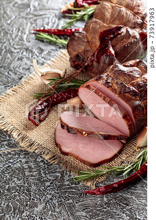Smoked ham with rosemary, garlic, and red pepper. 73917963