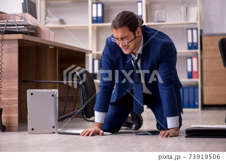 Young male businessman employee unhappy with his work Young male businessman employee unhappy with his work 73919506