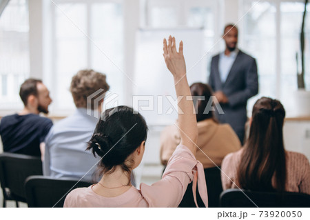 Male speaker giving presentation in hall at workshop. Audience or conference hall. Rear view of unrecognized participants. Male speaker giving presentation in hall at workshop. Audience or conference hall. Rear view of unrecognized participants. 73920050