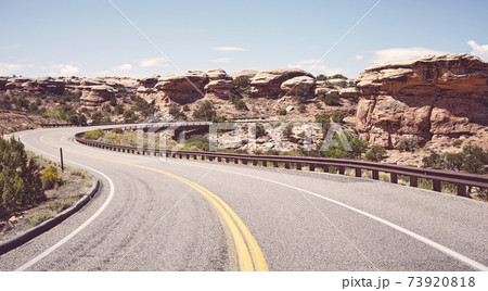 Retro toned picture of road bend, USA. Retro toned picture of road bend, USA. 73920818