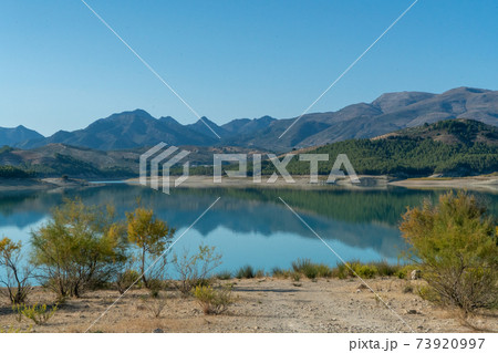 View on a beautiful mountain lake in Andalusia in Spain View on a beautiful mountain lake in Andalusia in Spain 73920997