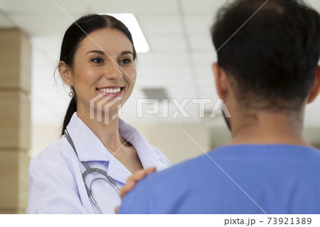 smiling female doctor helping support and reassuring patient after cancer surgical treatment recovery. medical and healthcare concept. 73921389