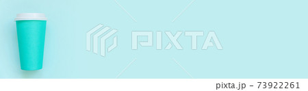 Simply flat lay design pink paper coffee cup on blue pastel colorful trendy background 73922261