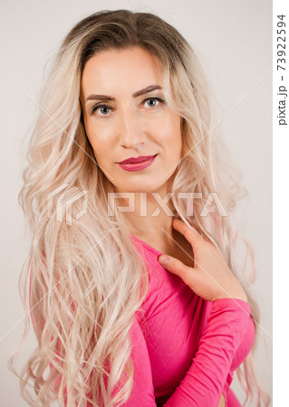 long-haired woman in pink 73922594