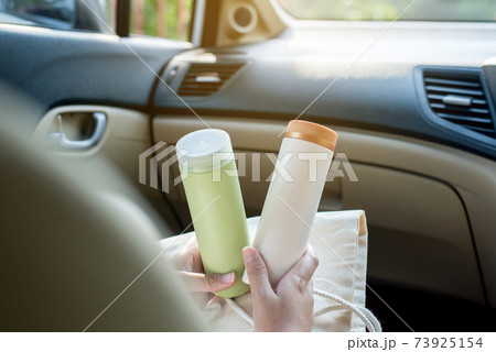 Hand woman holding 2 plastic reusable drink a cup,Environmental friendly,Healthy green,Zero waste,Conscious lifestyle concept Hand woman holding 2 plastic reusable drink a cup,Environmental friendly,Healthy green,Zero waste,Conscious lifestyle concept 73925154