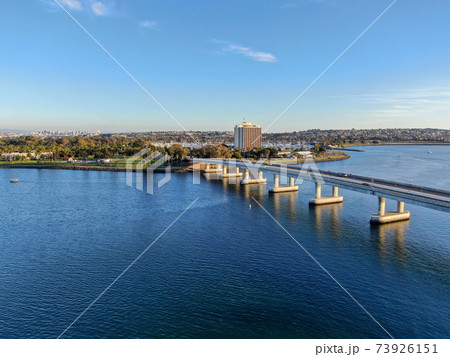 Aerial view of Mission Bay in San Diego, with Ingraham Street bridge during summer sunny day.  73926151