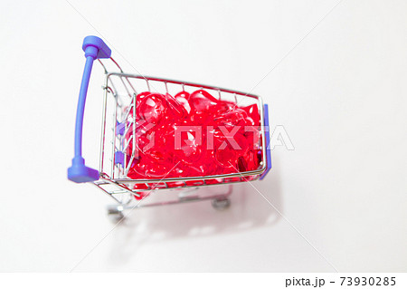 Valentine's day, endless love or special occasion concept : Top view of red hearts spilled out of a shopping cart. isolated on white background. copy space. Valentine's day, endless love or special occasion concept : Top view of red hearts spilled out of a shopping cart. isolated on white background. copy space. 73930285