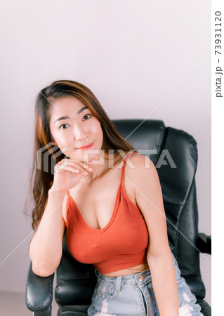 Sexy office asian woman sitting on chairs working Sexy office asian woman sitting on chairs working 73931120