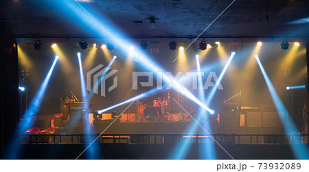 Empty stage concert with colorful lighting laser beam spotlight show in disco pub club bar background for party music dancing festival performance. Entertainment nightlife. Celebration event. 73932089