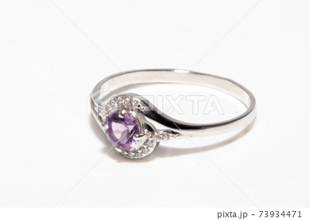 Beautiful silver ring with purple gemstone isolated on white background Beautiful silver ring with purple gemstone isolated on white background 73934471