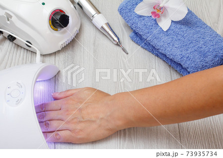 Set of cosmetic tools on a gray wooden background. Set of cosmetic tools on a gray wooden background. 73935734