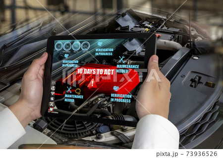 Engineer use augmented reality software to monitor parts of car vehicle 73936526