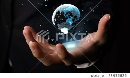 Human hand holding earth globe holographic technology Human hand holding earth globe holographic technology 73936626