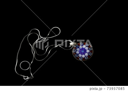 Beautiful murano glass pendant with chain isolated on black background Beautiful murano glass pendant with chain isolated on black background 73937085