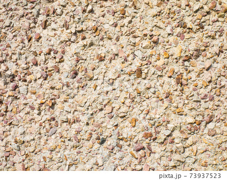 Concrete wall background with stones Concrete wall background with stones 73937523