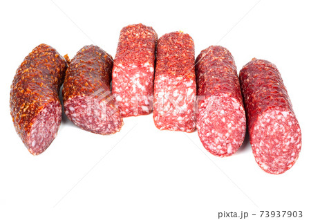 Smoked sausage in assortment on a white background Smoked sausage in assortment on a white background 73937903