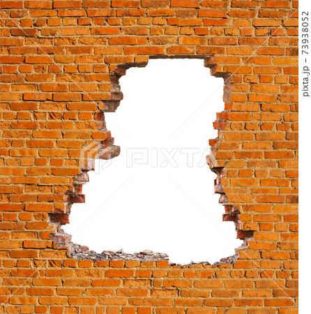 Broken hole in an old brick wall Broken hole in an old brick wall 73938052