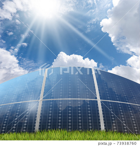 Group of Solar Panels on Blue Sky with Clouds and Sun Rays Group of Solar Panels on Blue Sky with Clouds and Sun Rays 73938760