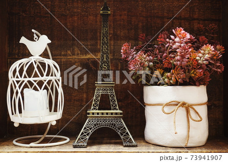 Eiffel tower statue with space copy on wooden background Eiffel tower statue with space copy on wooden background 73941907