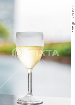White wine in a glass White wine in a glass 73945463
