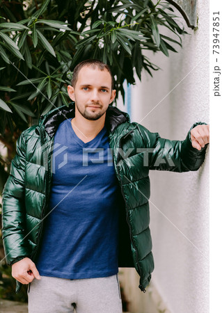 man wearing blue t-shirt mockup and jacket outdoors man wearing blue t-shirt mockup and jacket outdoors 73947851